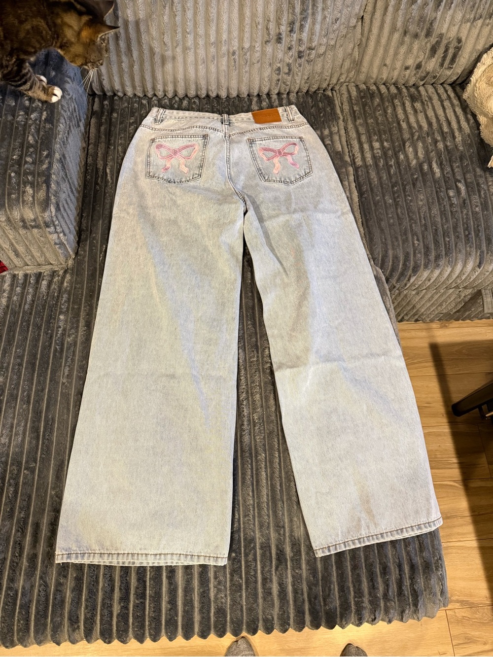 White Fox Boutique Light Wash Wide-Leg Jeans with bow detail